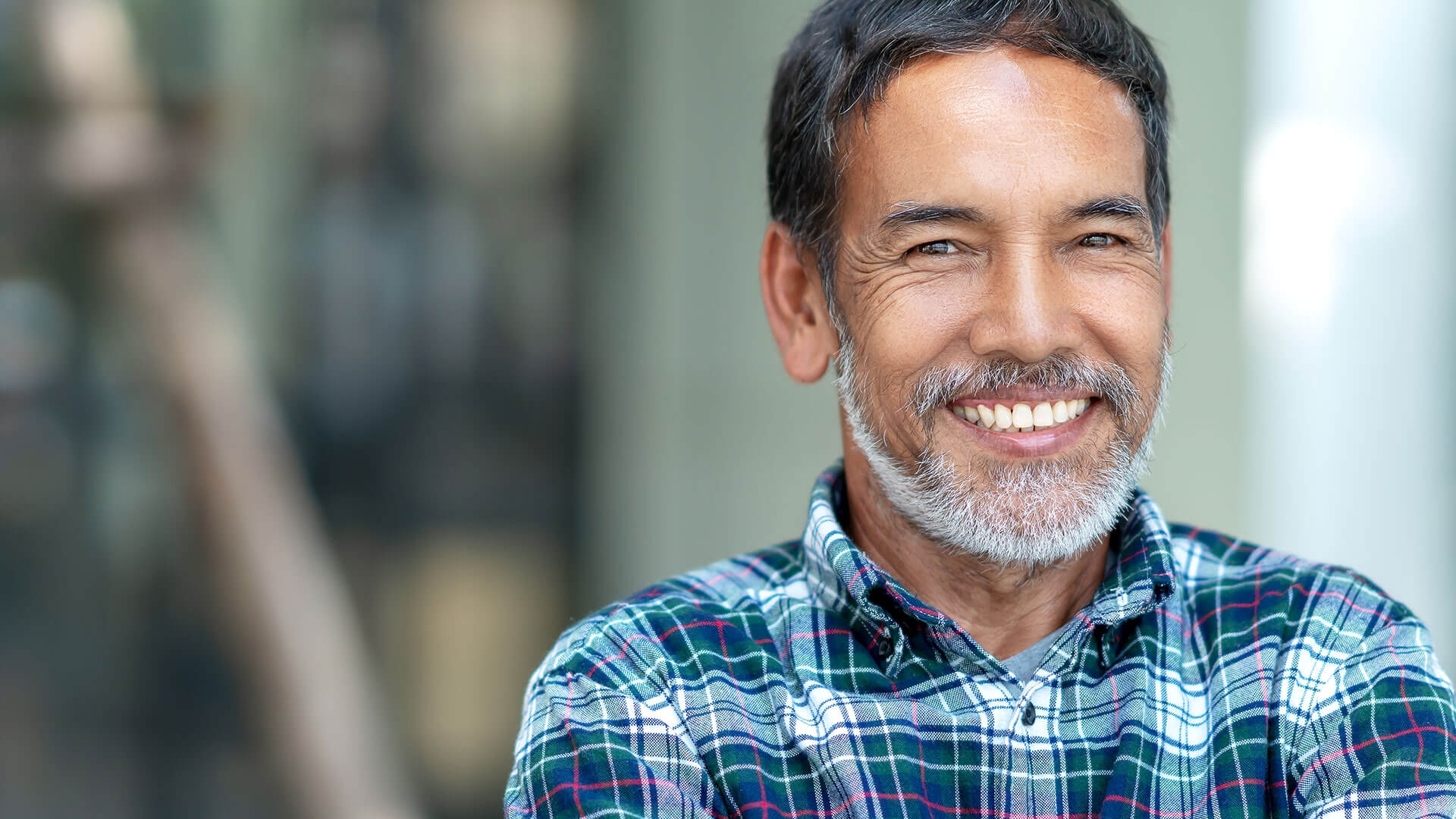 Middle aged implant patient smiling 