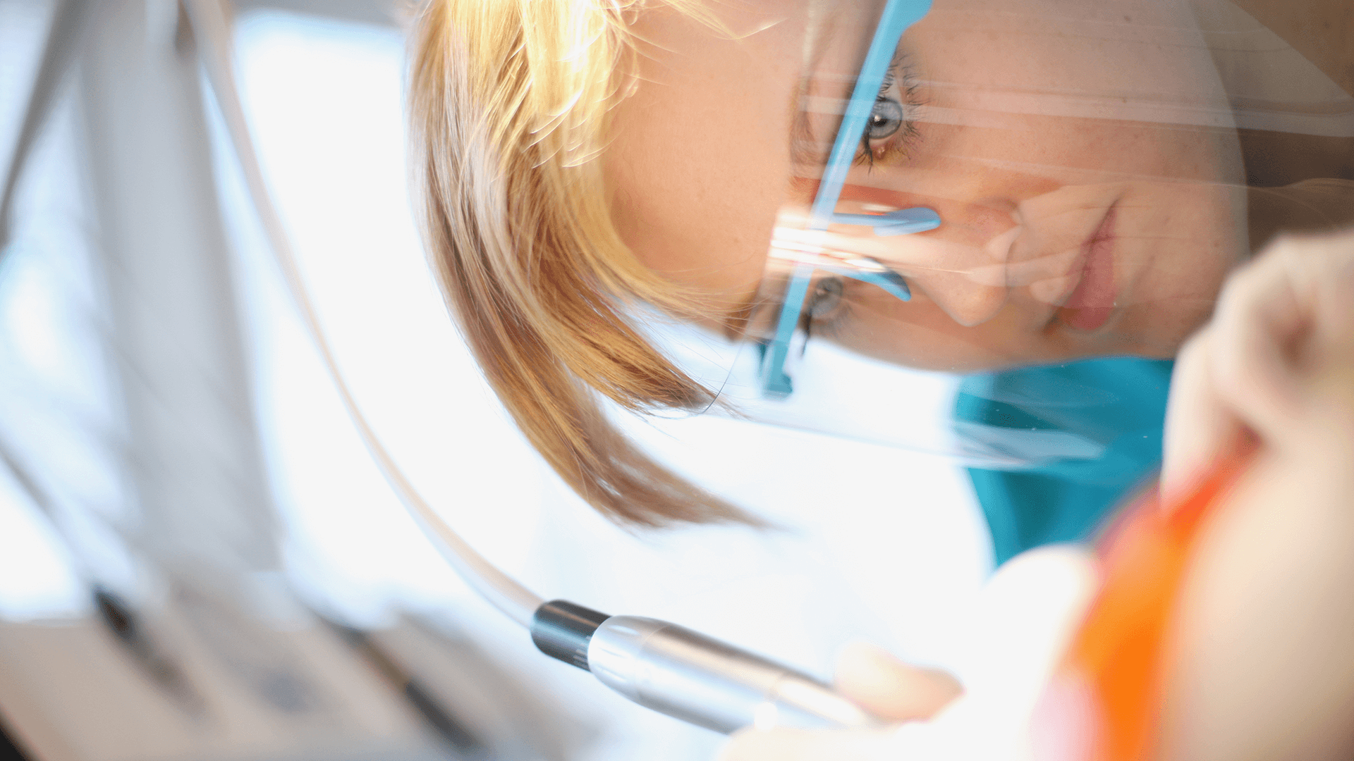 Dental hygienist works on deep cleaning for gum disease patient