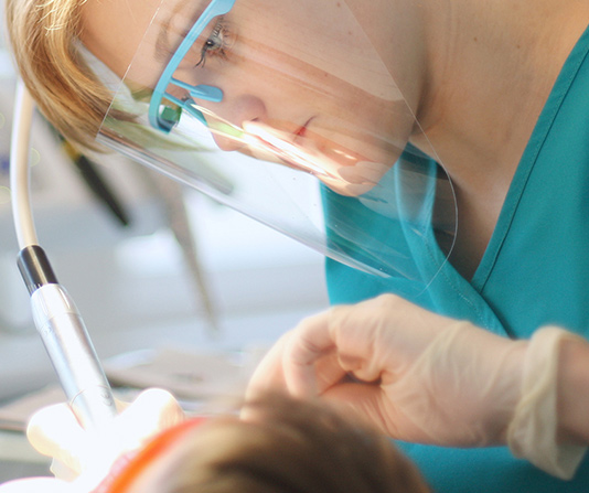 Patient being checked by dentist
